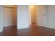 Bedroom with wood floors and walk-in closet at 210 3Rd W St # 8202, Bradenton, FL 34205