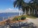 Waterfront walkway with palm trees and bridge view at 210 3Rd W St # 8202, Bradenton, FL 34205