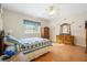 Bedroom with wood floors and a large closet at 24181 Green Heron Dr # 84, Punta Gorda, FL 33980