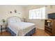 Cozy bedroom with a double bed and hardwood floors at 24181 Green Heron Dr # 84, Punta Gorda, FL 33980