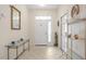 Bright and airy entryway with glass-top console table at 24181 Green Heron Dr # 84, Punta Gorda, FL 33980
