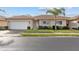 Well-maintained house with a garage and palm tree landscaping at 24181 Green Heron Dr # 84, Punta Gorda, FL 33980