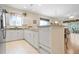 Spacious kitchen with white cabinets and granite countertops at 24181 Green Heron Dr # 84, Punta Gorda, FL 33980