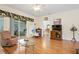 Spacious living room with hardwood floors and access to patio at 24181 Green Heron Dr # 84, Punta Gorda, FL 33980