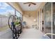 Relaxing screened porch with seating and plants at 24181 Green Heron Dr # 84, Punta Gorda, FL 33980