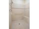 Walk-in shower with tiled walls and safety features at 24181 Green Heron Dr # 84, Punta Gorda, FL 33980