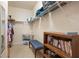 Large walk-in closet with shelving and a bench at 24181 Green Heron Dr # 84, Punta Gorda, FL 33980