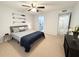 King-size bed in a bright bedroom with ceiling fan at 2691 Sabal Springs Cir # 206, Clearwater, FL 33761