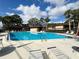 Community pool with lounge chairs at 2691 Sabal Springs Cir # 206, Clearwater, FL 33761