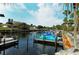 Community boat docks on a calm waterway at 2743 Riverbluff Ct # V94, Sarasota, FL 34231