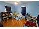 Bedroom with two twin beds and built-in shelving at 3310 Lexington St, Sarasota, FL 34231