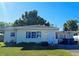 Ranch-style home with a carport and a spacious yard at 3310 Lexington St, Sarasota, FL 34231