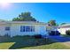 Front view of a single story house with lawn at 3310 Lexington St, Sarasota, FL 34231