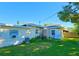 House exterior showcasing back view and lawn at 3310 Lexington St, Sarasota, FL 34231