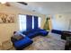 Living room with blue sectional sofa and a Christmas tree at 3310 Lexington St, Sarasota, FL 34231