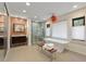 Modern bathroom with standalone tub, glass shower, and mosaic tile accent wall at 3348 Old Oak Dr, Sarasota, FL 34239