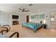 Cozy bedroom with fireplace, seating area, and a comfortable bed at 3348 Old Oak Dr, Sarasota, FL 34239