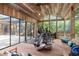 Spacious home gym with exercise equipment, comfortable seating, and natural light at 3348 Old Oak Dr, Sarasota, FL 34239