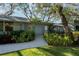 Charming single-story home with a lush landscaped walkway leading to the front door at 3350 Old Oak Dr, Sarasota, FL 34239