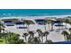 Sandy beach with blue cabanas, volleyball court, and ocean views at 3606 Fair Oaks Pl, Longboat Key, FL 34228