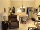 Charming dining area with table and chairs, near kitchen at 3645 Longmeadow # 31, Sarasota, FL 34235