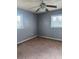 Empty bedroom with gray walls and carpeting at 406 Laurel E Rd, Nokomis, FL 34275