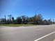 Street view of a property with houses and open land at 406 Laurel E Rd, Nokomis, FL 34275