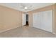 Bedroom with neutral walls, carpet flooring, and double door closet at 425 30Th W Ave # C107, Bradenton, FL 34205