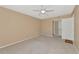 Spacious bedroom with neutral walls and carpet flooring at 425 30Th W Ave # C107, Bradenton, FL 34205