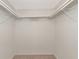 Spacious reach-in closet with double hanging rods and shelving at 425 30Th W Ave # C107, Bradenton, FL 34205