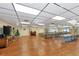 Spacious community room with tables and a large TV at 425 30Th W Ave # C107, Bradenton, FL 34205