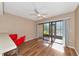 Bright dining area with sliding doors to screened patio at 425 30Th W Ave # C107, Bradenton, FL 34205
