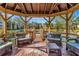 Relaxing gazebo with seating overlooking the lake at 425 30Th W Ave # C107, Bradenton, FL 34205