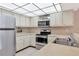 Bright kitchen features stainless steel appliances and ample cabinetry at 425 30Th W Ave # C107, Bradenton, FL 34205