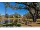 Community lake with gazebo, dock, and seating area at 425 30Th W Ave # C107, Bradenton, FL 34205