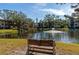 Serene lake view with bench and landscaping at 425 30Th W Ave # C107, Bradenton, FL 34205