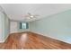 Spacious living room with light walls and laminate flooring at 425 30Th W Ave # C107, Bradenton, FL 34205