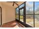 Bright screened porch with tile floor and access to patio at 425 30Th W Ave # C107, Bradenton, FL 34205