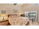 Spacious bedroom with hardwood floors and access to the patio at 4419 Glebe Farm Rd # 149, Sarasota, FL 34235