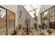 Private courtyard with fountain and various plants at 4419 Glebe Farm Rd # 149, Sarasota, FL 34235