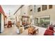 Open dining area with hardwood floors and view into the kitchen and Gathering room at 4419 Glebe Farm Rd # 149, Sarasota, FL 34235