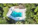 Community pool with surrounding deck and lush landscaping at 4419 Glebe Farm Rd # 149, Sarasota, FL 34235