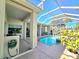 Screened-in pool with spa and outdoor kitchen area at 5245 88Th E St, Bradenton, FL 34211