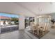 Bright dining room with patio access and a view of the backyard at 5512 Gardens Dr, Sarasota, FL 34243