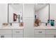 A modern bathroom with double sinks, granite countertops, and vanity storage at 5706 Bent Oak Dr, Sarasota, FL 34232