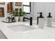 Modern bathroom with a sleek sink and quartz countertop at 5706 Bent Oak Dr, Sarasota, FL 34232