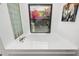 Bathroom featuring a large soaking tub with a window view and a glass block shower at 5706 Bent Oak Dr, Sarasota, FL 34232