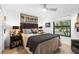 Cozy bedroom with a queen bed and tiled floors at 5706 Bent Oak Dr, Sarasota, FL 34232