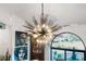 Close-up view of a modern sputnik-style chandelier at 5706 Bent Oak Dr, Sarasota, FL 34232