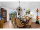 Dining room featuring a table with seating for eight and a chandelier at 5706 Bent Oak Dr, Sarasota, FL 34232